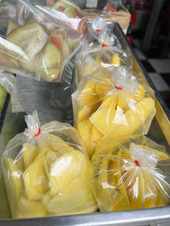 close up mango fruit in plastic bag in marketの写真素材