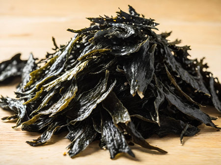seaweed salad in black bowl on wooden board backgroundの素材