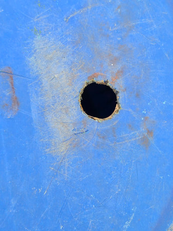 metal hole in the blue color. metal texture.の写真素材
