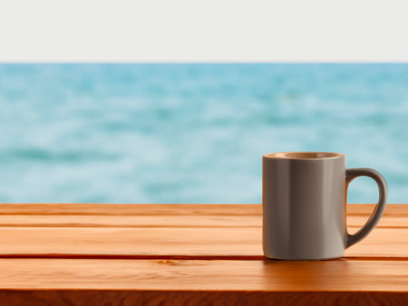 coffee cup on table near the sea backgroundの写真素材
