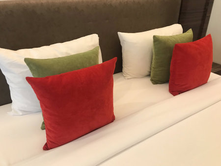 pillows on the bed in the bedroomの写真素材