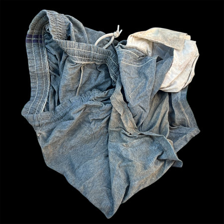 old Short pants, soft fabric on black background