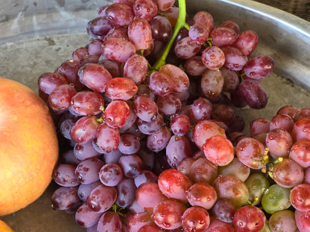 ripe red grapes on tray