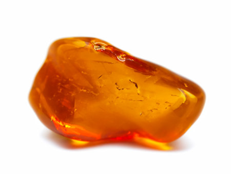 amber mineral stone with a amber isolated on white backgroundの素材