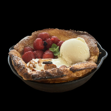 a piece of delicious pie with a strawberry ice cream in a plateの写真素材