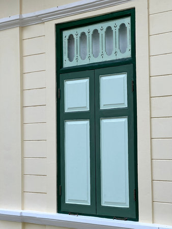 green door in front of a window