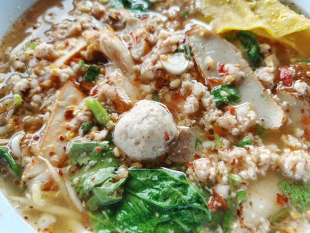 chicken noodles with vegetables in bowlの写真素材