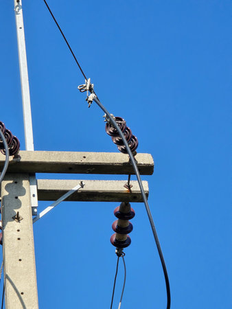 electrical high voltage power line on blue sky background