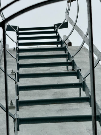 concrete staircase with a metal handrail.の写真素材