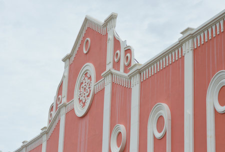 white building on red wall on the blue skyの写真素材