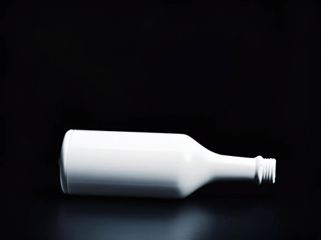 empty bottle on a black background.の素材