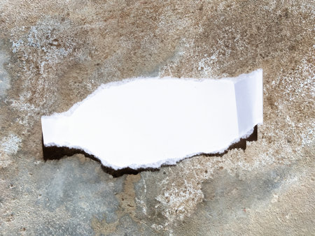 piece of white paper on stone floorの写真素材