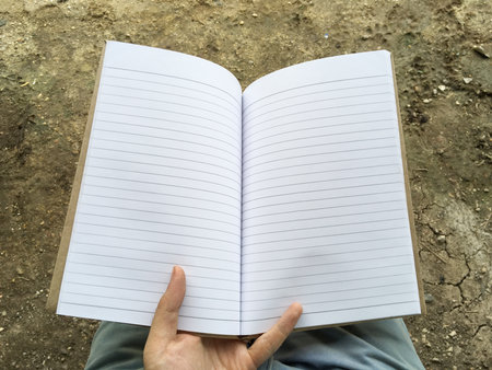 hand and paper bookの写真素材