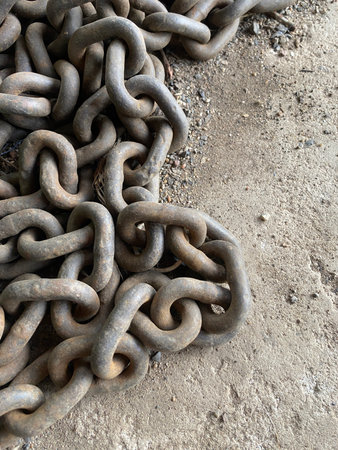 a closeup shot of an old and worn rusty chain