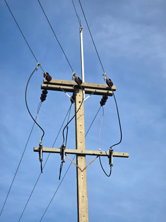 high voltage pole and electric lines in the countryside