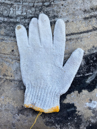 old dirty gloves on the groundの写真素材