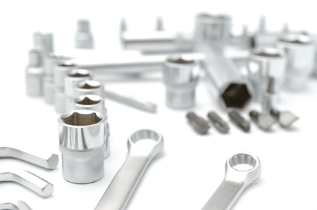metallic spanners on white background