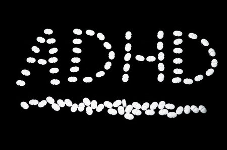 Generic Adderall pills arrange to spell ADHD (Attention Deficit Hyperactivity Disorder)