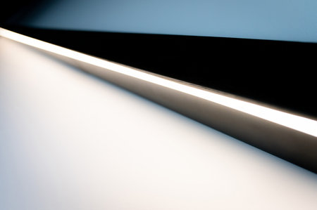 NATIONAL LANE DAY. Light and shadows lines on the white and blue wall. Led line, the light rays. Mockup, copy space for textの写真素材