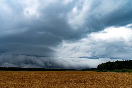 Storm Clouds over Field, Tornadic Supercell, Extreme Weather, Dangerous Storm, Climate Change, Rain Day, International Sky Day, World Meteorological Dayの写真素材