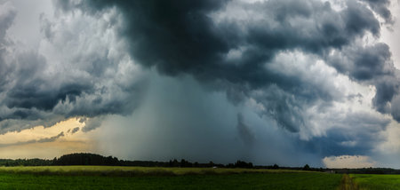 Dramatic stormy sky with dark clouds. Panoramic image.