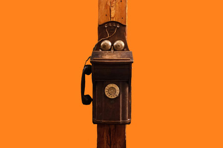Vintage Day. Old Vintage Telephone Isolated on Orange Background. Estonia Voruの写真素材