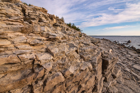 Beautiful rocky sea shore. Baltic limestone cliff. Estonia Saaremaa Augustの写真素材