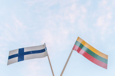 Lithuanian buying Helsinki Seagulls. Finalnd stadium. Helsinki basketball team. Flag of Lithuania and flag of Finland on a sky backgroundの写真素材