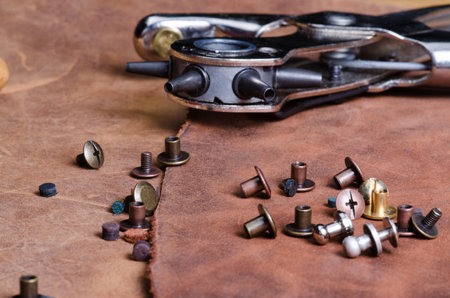 NATIONAL LEATHERCRAFT DAY. Leather craft tools on big peace of leather. Leather craft workshop.