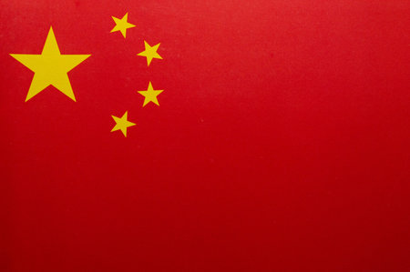 Flag of China, National Flag of the People's Republic of China Five-starred Red Flag State flag of China simple old aged worn grunge paper background texture, closeup, nobody.の写真素材