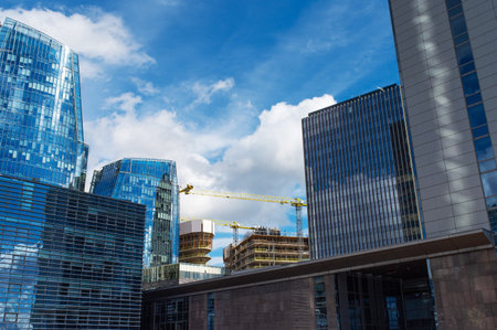 Lithuania Economy. Booming concept. Business and Real Estate. Beautiful view of Vilnius business district with cranes building new building illustration. City life in Vilnius, Lithuania.の写真素材