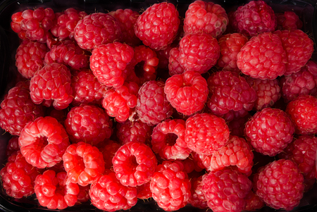 Fresh ripe raspberries as background