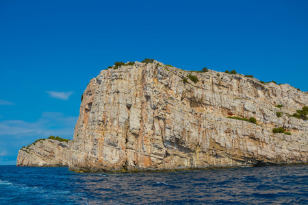 Big rock in Adriatic Sea Croatia Europe. Landscape and nature. Ocean blue sky. Warm summer day.の写真素材