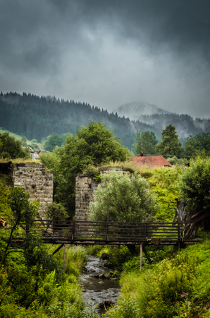 Beautiful Vorokhta place in Ukraine. Stone wall and old bridge. Ukraineの写真素材