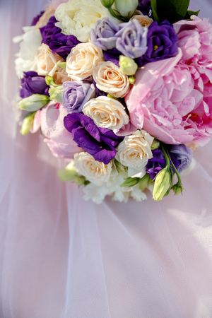 Pink bouquet of roses on the pink backgroundの写真素材