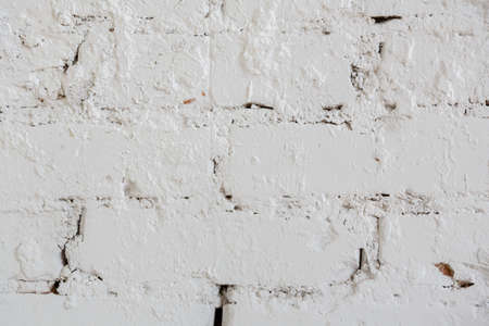 background and texture, brick wall painted with white paint or hard puttyの写真素材