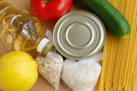Stock of food. A set of essentials for those in need. Fruits and vegetables, canned and pasta, oil and cerealsの写真素材