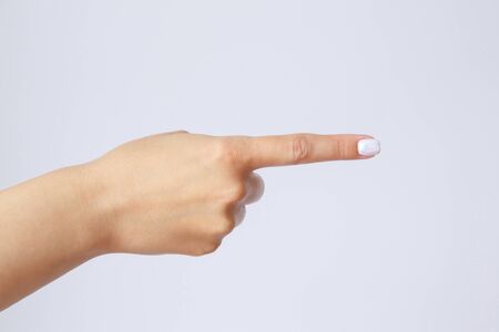 Gesture and sign, female hand on a white background. Fingers showingの写真素材