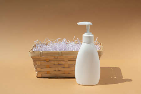 wicker basket and white dispenser bottle, for spa cosmetics