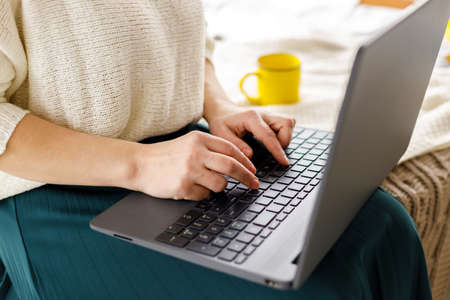 hands business woman works at laptop. Female in business. Keyboard laptop