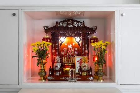 Chinese household shrine in a floor dashboardの写真素材