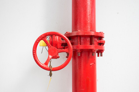 red firefighter water pipe with manual valveの写真素材