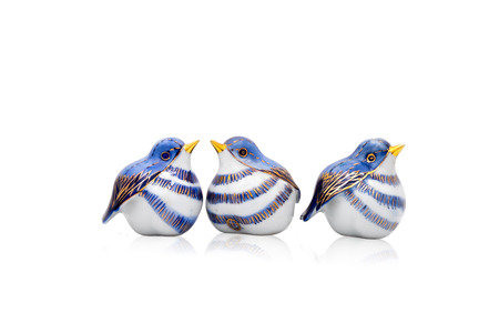 Three artificial Chinese style ceramic birdsの写真素材