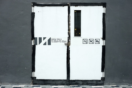 closed restaurant door show open and close time. and what is prohibitedの写真素材