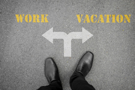 Black shoes has decision to make at the cross road - work or vacationの写真素材