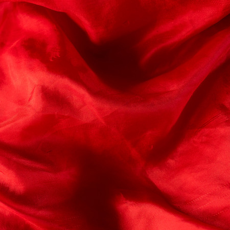 Red cloth detailed texture as backgroundの写真素材