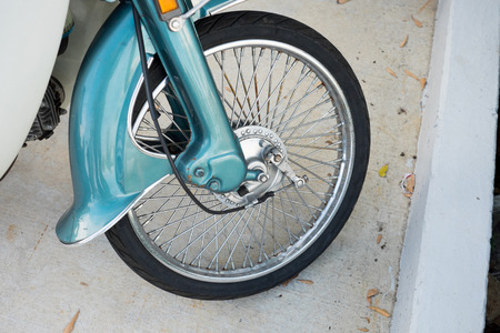 Old style motorcycle front wheel, tire, disc brakeの写真素材