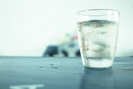 Glass of wisky, soda and ice on the table