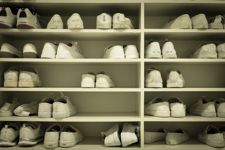 shoes rack in uniform changing room in factory or schoolの写真素材