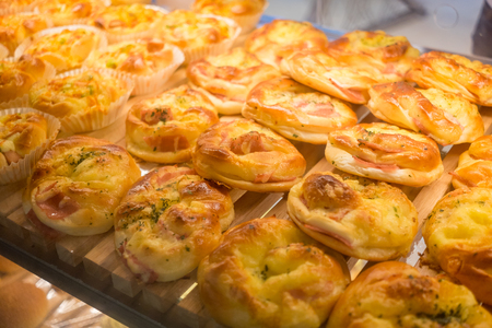 Warm fresh ham cheese bread in trayの写真素材